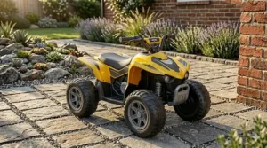 A photorealistic close-up of a battery-powered toy motorcycle for kids, featuring a red body and leather-look seat, standing on a textured stone paver patio.