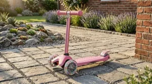 A photorealistic close-up of a teal preschool tricycle with a black padded seat, storage basket, and detachable parent steering handle.