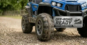 A detailed view of heavy-duty rubber tires on a 24v UTV designed to handle grass and rough terrain for kids.