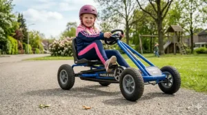 A sleek pedal-powered go-kart in blue showing the chain drive mechanism for active outdoor play.