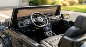 Detailed interior dashboard of a realistic electric ride on car showing a light-up speedometer, steering wheel buttons, and an MP3 player interface.