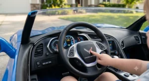 Illustration of a blue Corvette ride-on car for toddlers showing realistic dashboard lights and horn.