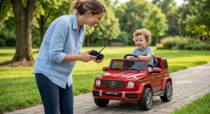 Parent holding wireless remote control to safely guide a toddler in a Mercedes-Benz ride-on car.