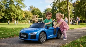 Two toddlers playing together with a stylish blue Audi R8 ride on car at a sunny neighborhood park