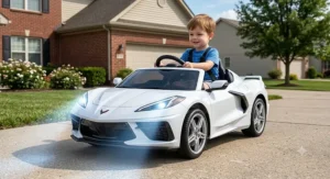 White Corvette ride-on car for toddlers featuring working LED headlights and safety harness.