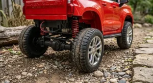 Rugged off-road wheels and rear spring suspension on a 24V Chevrolet Silverado ride on toy