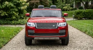 Front view of a 24V Range Rover ride-on car featuring bright LED headlights and iconic front grille.