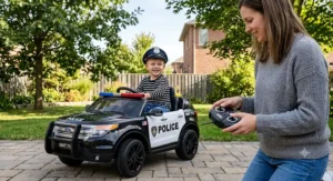 Parent using a wireless remote control while child sits in a 12V electric ride on police car.