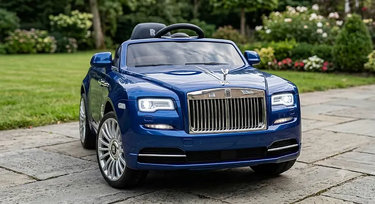 Front view of a luxury electric Rolls Royce ride-on car for kids with iconic grille and functional LED headlights
