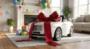 White Rolls Royce ride-on car for kids decorated with a giant red bow as a birthday gift presentation