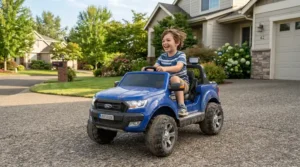 An affordable 24V ride-on car for big kids being driven by a smiling older child on a paved suburban driveway.