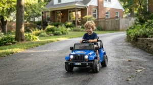 A powerful 12V all-terrain ride-on car for 5 year old cruising down a suburban driveway.