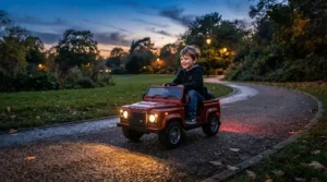 A battery-powered toddler car showcasing glowing LED headlights during a late afternoon ride.