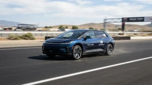 A budget high-speed ride-on car for preteens undergoing a speed test on smooth asphalt.