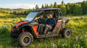 An off-road electric vehicle for teenagers showcasing its high weight limit with two tall teens inside.