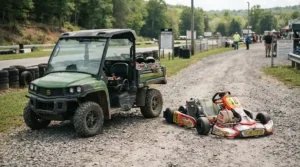 An off-road electric vehicle for teenagers parked on rough terrain next to a traditional go-kart.