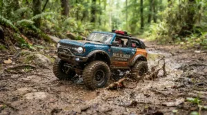 An off-road ride-on car for preteens driving through a muddy dirt trail in a suburban backyard.