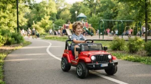 A ride-on car for preschooler with disability rolling smoothly on a community park asphalt path.