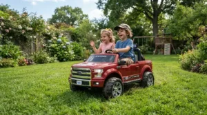 Two young children safely driving a 12v two seater ride on truck for two toddlers across a green backyard lawn.