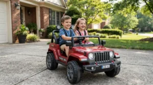 Two kids riding together in a 24v two seater ride on car for kids 3 to 8 years on a suburban driveway