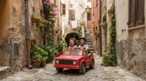 A front and back two seater ride on car for narrow driveways navigating a tight side yard between a house and a fence.