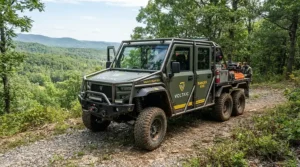 A sturdy off-road electric vehicle for adults featuring a high weight capacity design parked in a forest clearing.