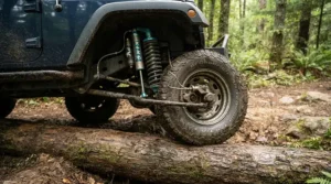 An off-road electric vehicle for adults demonstrating advanced suspension and ground clearance over a fallen log.
