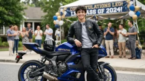 Proud graduate posing next to a brand-new ride-on vehicle for teens decorated for celebration