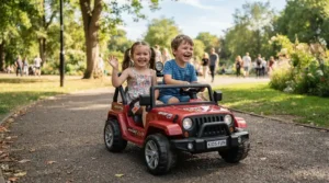 Two kids smiling while cruising in a side by side electric ride on car for siblings at the neighborhood park.